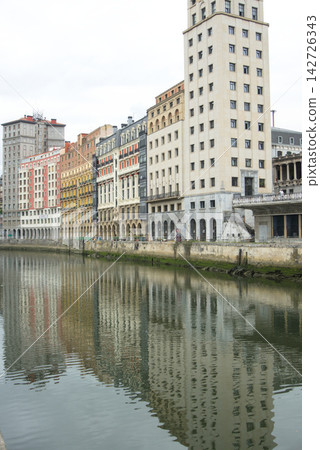 Riverside buildings reflected in the Nervion estuary in Bilbao, Basque Country Riverside buildings reflected in the Nervion estuary in Bilbao, Basque Country 142726343