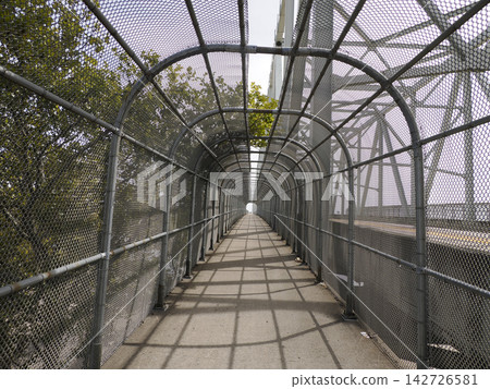 The Purple People Bridge is a pedestrian-only bridge that stretches 2,670 feet over the Ohio River, connecting Newport, Kentucky to downtown Cincinnati, Ohio. The Purple People Bridge is a pedestrian-only bridge that stretches 2,670 feet over the Ohio River, connecting Newport, Kentucky to downtown Cincinnati, Ohio. 142726581