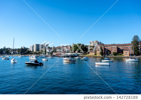 Manly Beach harbor with boats and waterfront buildings in Sydney, Australia Manly Beach harbor with boats and waterfront buildings in Sydney, Australia 142728189