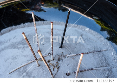 Burning incense sticks on Miyajima Island in Hiroshima, Japan Burning incense sticks on Miyajima Island in Hiroshima, Japan 142728197