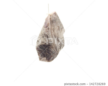 used tea bag on spoon used tea bag on spoon 142728269