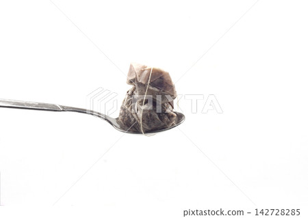 used tea bag on spoon used tea bag on spoon 142728285