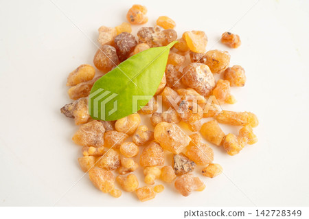Frankincense or olibanum aromatic resin isolated on white background used in incense and perfumes. 142728349