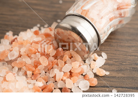 Sodium chloride Himalayan pink salt with salt shaker. Sodium chloride Himalayan pink salt with salt shaker. 142728395