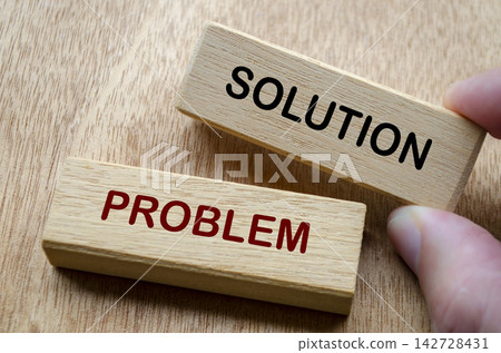 Wooden blocks labeled solution and problem representing practical problem solving and decision making 142728431