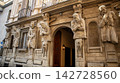statue of a man in an ancient city 142728560
