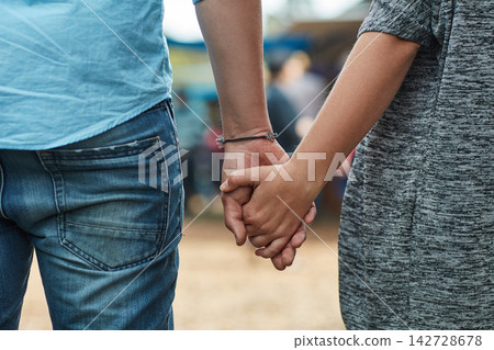 Love, couple and holding hands outdoor for support, care and bonding together in nature. Man, woman and back view on holiday for connection, trust and commitment to healthy relationship in marriage Love, couple and holding hands outdoor for support, care and bonding together in nature. Man, woman and back view on holiday for connection, trust and commitment to healthy relationship in marriage 142728678