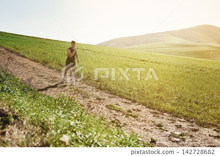 Man, earphones and tired of running in outdoor, marathon training and health in countryside. Male person, fatigue and music for motivation in nature, fitness and radio for cardio or listen to song Man, earphones and tired of running in outdoor, marathon training and health in countryside. Male person, fatigue and music for motivation in nature, fitness and radio for cardio or listen to song 142728682