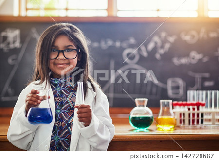 Child, classroom and science beaker for learning, education and test with smart or intelligent girl. Portrait of student in school with chemistry, knowledge and liquid for experiment and presentation Child, classroom and science beaker for learning, education and test with smart or intelligent girl. Portrait of student in school with chemistry, knowledge and liquid for experiment and presentation 142728687