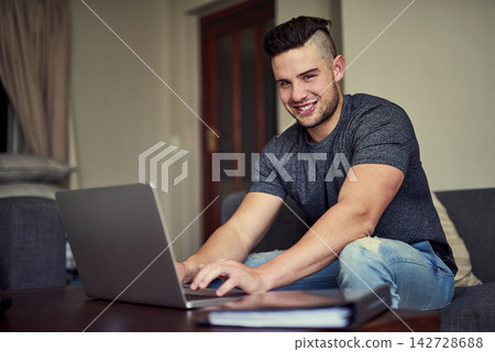 Portrait of happy man, work from home or laptop for copywriting or planning or research on website. Intern, freelancer or confident blog writer typing on couch with smile, internet or editing project Portrait of happy man, work from home or laptop for copywriting or planning or research on website. Intern, freelancer or confident blog writer typing on couch with smile, internet or editing project 142728688
