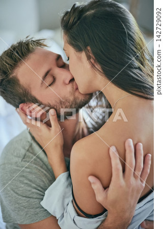 Love, affection and couple in bedroom with kiss, romance and and morning bonding in apartment. Relationship, man and woman in bed with intimate embrace, passion and relax with care on weekend in home Love, affection and couple in bedroom with kiss, romance and and morning bonding in apartment. Relationship, man and woman in bed with intimate embrace, passion and relax with care on weekend in home 142729092
