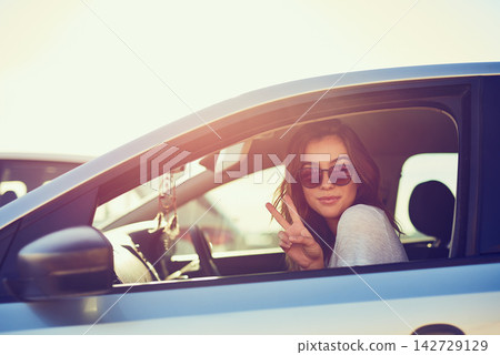 Woman, car and sunglasses by window in summer for travel, freedom and vacation with sunshine outdoor. Girl, shades and relax with peace sign in motor for road trip, holiday or adventure in California Woman, car and sunglasses by window in summer for travel, freedom and vacation with sunshine outdoor. Girl, shades and relax with peace sign in motor for road trip, holiday or adventure in California 142729129
