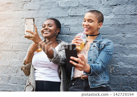Online, friends and selfie on social media in city with coffee break and gen z influencer post to app. Happy, people and black woman share profile picture and relax by live streaming on smartphone Online, friends and selfie on social media in city with coffee break and gen z influencer post to app. Happy, people and black woman share profile picture and relax by live streaming on smartphone 142729194