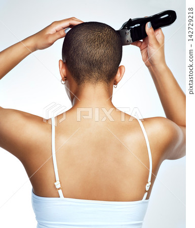 Woman, back and haircut with electric razor in studio for change, maintenance and hair removal. Person, grooming and personal care on white background for trim, shave and clippers for balding Woman, back and haircut with electric razor in studio for change, maintenance and hair removal. Person, grooming and personal care on white background for trim, shave and clippers for balding 142729218