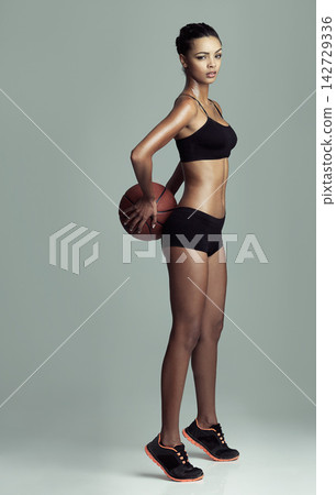 Exercise, frown and basketball with portrait of woman in studio isolated on gray background. Fitness, sports or workout and serious athlete with attitude training for challenge, health or performance Exercise, frown and basketball with portrait of woman in studio isolated on gray background. Fitness, sports or workout and serious athlete with attitude training for challenge, health or performance 142729336