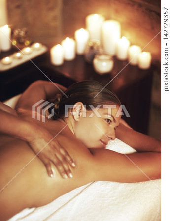 Woman, spa and relax with massage for wellness in Mauritius, rest with pamper for body. Female person, beauty and healing in salon with candles for peace, happiness or skin care on island vacation Woman, spa and relax with massage for wellness in Mauritius, rest with pamper for body. Female person, beauty and healing in salon with candles for peace, happiness or skin care on island vacation 142729357