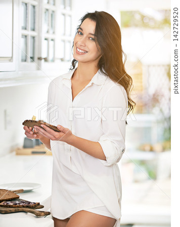 Happy, woman and buttering toast for breakfast in kitchen for healthy food, morning routine and nutrition. Smile, female person and cooking bread for organic start to day at home for wellness Happy, woman and buttering toast for breakfast in kitchen for healthy food, morning routine and nutrition. Smile, female person and cooking bread for organic start to day at home for wellness 142729520