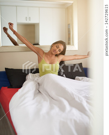 Wake up, stretching and woman relax in bedroom for health, wellness and fresh morning energy in home. Bed, comfort and girl awake after sleep, rest and peace to start day on mattress in apartment Wake up, stretching and woman relax in bedroom for health, wellness and fresh morning energy in home. Bed, comfort and girl awake after sleep, rest and peace to start day on mattress in apartment 142729615