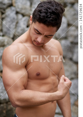 Man, shirtless and flex with bicep for strong bodybuilder, exercise and fitness in nature. Male athlete, workout and arm with muscle for wellness, training or healthy for sport with weight lifting Man, shirtless and flex with bicep for strong bodybuilder, exercise and fitness in nature. Male athlete, workout and arm with muscle for wellness, training or healthy for sport with weight lifting 142729634
