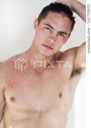 Confident, portrait or man washing in shower for skincare, body hygiene or health in apartment. Wet, bathroom or person in home with wellness for shampoo, grooming or cleansing for morning routine Confident, portrait or man washing in shower for skincare, body hygiene or health in apartment. Wet, bathroom or person in home with wellness for shampoo, grooming or cleansing for morning routine 142729935