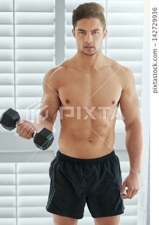 Muscular man, portrait and weightlifting with dumbbell for fitness, strength or muscle gain at home. Active male person or bodybuilder with small weight for workout, exercise or training at house Muscular man, portrait and weightlifting with dumbbell for fitness, strength or muscle gain at home. Active male person or bodybuilder with small weight for workout, exercise or training at house 142729936