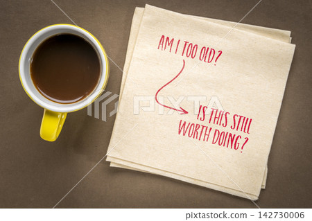 Am I Too Old? Is This Still Worth Doing? Handwritten mindset shift on a napkin with coffee, challenging age limitations and encouraging purpose, curiosity, and meaningful action. Am I Too Old? Is This Still Worth Doing? Handwritten mindset shift on a napkin with coffee, challenging age limitations and encouraging purpose, curiosity, and meaningful action. 142730006