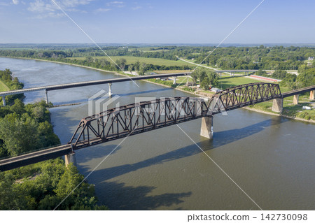 Highway and railroad bridges across the Missouri RIver at Rulo, Nebraska, summer aerial view Highway and railroad bridges across the Missouri RIver at Rulo, Nebraska, summer aerial view 142730098