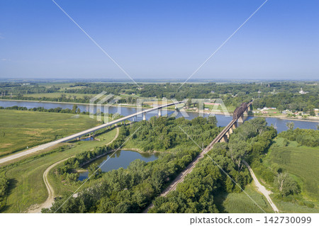 Highway and railroad bridges across the Missouri RIver at Rulo, Nebraska, summer aerial view Highway and railroad bridges across the Missouri RIver at Rulo, Nebraska, summer aerial view 142730099