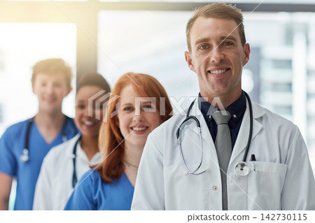 Leader, portrait and medical group in hospital for career, about us or service in line at clinic. Face, happy people and healthcare team, doctors and expert professional nurses together for wellness 142730115