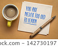 You Are Never Too Old to Learn. Inspirational handwritten message on a napkin with coffee and pen, celebrating lifelong learning, curiosity, personal growth, and active aging. 142730197