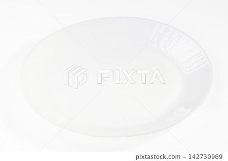Empty white ceramic plate on plain white background with soft shadow and glossy surface Empty white ceramic plate on plain white background with soft shadow and glossy surface 142730969