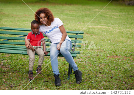 Woman, volunteer and child in portrait or outdoor for time together, smile on park bench for community. Female person, boy and garden with happiness for charity, help with growth and development Woman, volunteer and child in portrait or outdoor for time together, smile on park bench for community. Female person, boy and garden with happiness for charity, help with growth and development 142731132