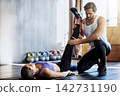 Physio, woman and legs stretching or helping for rehabilitation, personal training or mobility. Client, coaching and athlete for knee pain injury in workout centre for flexibility, gym or exercise 142731190