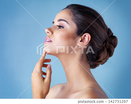 Relax, makeup and profile of woman in studio with natural beauty, confidence and luxury cosmetics. Dermatology, thinking and girl with facial care, skincare glow and healthy skin on blue background. Relax, makeup and profile of woman in studio with natural beauty, confidence and luxury cosmetics. Dermatology, thinking and girl with facial care, skincare glow and healthy skin on blue background. 142731207