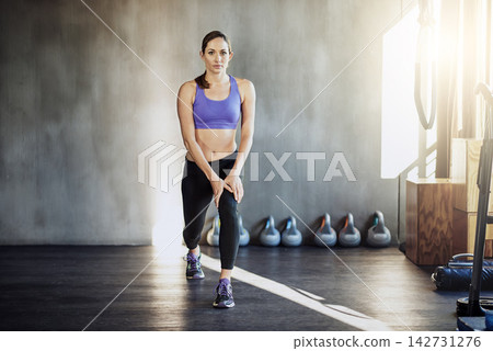 Woman, portrait and stretching legs for training workout in gym centre for mobility, flexibility or agility. Female person, muscle and sports growth or fitness strength, physical activity or warm up Woman, portrait and stretching legs for training workout in gym centre for mobility, flexibility or agility. Female person, muscle and sports growth or fitness strength, physical activity or warm up 142731276