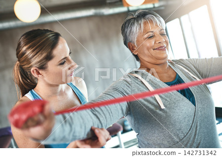 Physiotherapy, stretching and mature woman with band for training, exercise and workout. Physical therapy, health and physiotherapist with equipment for person for wellness, health and wellbeing Physiotherapy, stretching and mature woman with band for training, exercise and workout. Physical therapy, health and physiotherapist with equipment for person for wellness, health and wellbeing 142731342