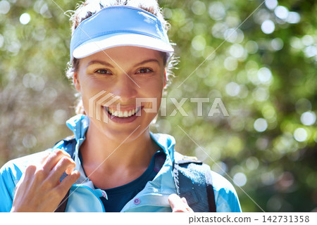 Ready, portrait or happy woman hiking in nature on outdoor adventure to explore on holiday vacation. Sightseeing, break or hiker trekking in woods for training, wellness or travel journey for fitness 142731358