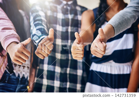 People, students and hands with thumbs up for review, vote or feedback in learning or education at school. Closeup of friends with like emoji, yes sign or OK for agree, unity or teamwork on campus People, students and hands with thumbs up for review, vote or feedback in learning or education at school. Closeup of friends with like emoji, yes sign or OK for agree, unity or teamwork on campus 142731359