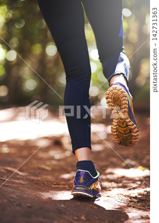 Shoes, runner or person running on trail in nature on outdoor adventure to explore in terrain footwear. Athlete, forest or hiker trekking in woods for training, wellness or travel journey for fitness Shoes, runner or person running on trail in nature on outdoor adventure to explore in terrain footwear. Athlete, forest or hiker trekking in woods for training, wellness or travel journey for fitness 142731363