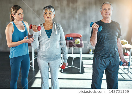 Physical therapy, dumbbell and senior people with support, help and muscle workout for recovery or health. Exercise, fitness and strength progress of mature clients in physiotherapy or wellness class Physical therapy, dumbbell and senior people with support, help and muscle workout for recovery or health. Exercise, fitness and strength progress of mature clients in physiotherapy or wellness class 142731369