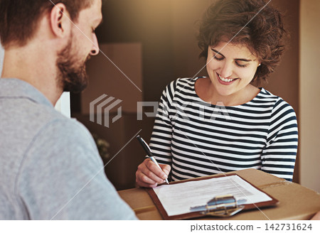 Woman, home and smile with signing for delivery or package, parcel and courier with moving in. Female person, new house and boxes with paperwork or document for shipment, mail and cargo with contract 142731624