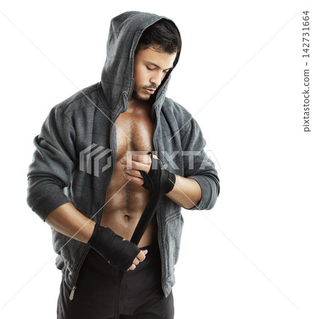 Healthy, athlete or boxer with hand wrap in studio background for fight, practice and exercise or workout. Muscle, man and hoodie on for strength, training and cardio or combat sport isolated white 142731664