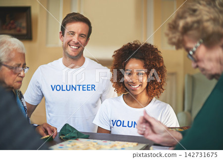 Nursing home, old women and volunteers with smile, help and community service with ngo, support and board game. Portrait, people and group with friends, elderly ladies and happiness with fun and play Nursing home, old women and volunteers with smile, help and community service with ngo, support and board game. Portrait, people and group with friends, elderly ladies and happiness with fun and play 142731675