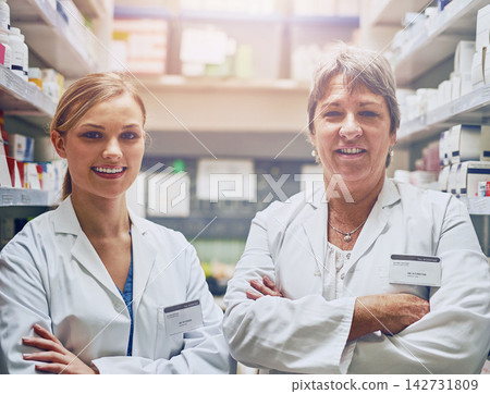 Pharmacy, team and portrait of women in store with drugs, pills or help search medicine inventory. Pharmacist, staff and working in shop with sale of medical product for healing or healthcare Pharmacy, team and portrait of women in store with drugs, pills or help search medicine inventory. Pharmacist, staff and working in shop with sale of medical product for healing or healthcare 142731809