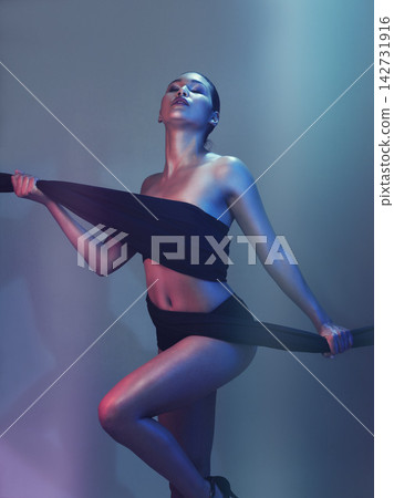 Girl, body and fabric for fashion in studio for creative art, glowing skin or beauty with textile. Fitness model, person or colorful aesthetic for wellness, skincare or cosmetics with neon background Girl, body and fabric for fashion in studio for creative art, glowing skin or beauty with textile. Fitness model, person or colorful aesthetic for wellness, skincare or cosmetics with neon background 142731916
