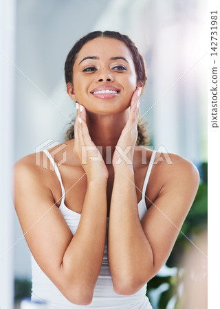 Home, mirror and woman in bathroom, skincare and wellness with grooming routine, smile and dermatology. Person, apartment and happy girl with beauty, reflection and cosmetics with treatment or health 142731981