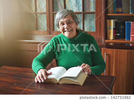 Senior woman, portrait and book for learning in home, literature and fiction novel in retirement. Female person, reader hobby and confident for language study, knowledge and information or story Senior woman, portrait and book for learning in home, literature and fiction novel in retirement. Female person, reader hobby and confident for language study, knowledge and information or story 142731982