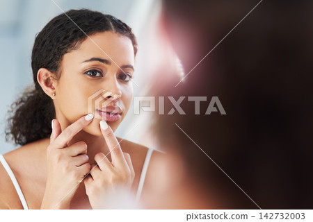 Woman, skincare and pimple acne in bathroom mirror or reflection for squeeze, problem or health. Female person, hands and dermatology hygiene or stress breakout for blackhead check, home or morning 142732003