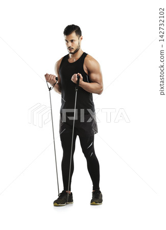 Man, exercise and resistance band for workout, training and fitness in studio with strong muscle. Athlete, sports and tension strap for health, wellness and body as determination on white background Man, exercise and resistance band for workout, training and fitness in studio with strong muscle. Athlete, sports and tension strap for health, wellness and body as determination on white background 142732102