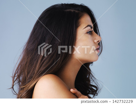 Profile, hair and beauty of woman for skincare, health or wellness isolated on blue studio background. Face, hairstyle and model in makeup cosmetics at hairdresser salon for glow, shine or thinking Profile, hair and beauty of woman for skincare, health or wellness isolated on blue studio background. Face, hairstyle and model in makeup cosmetics at hairdresser salon for glow, shine or thinking 142732229